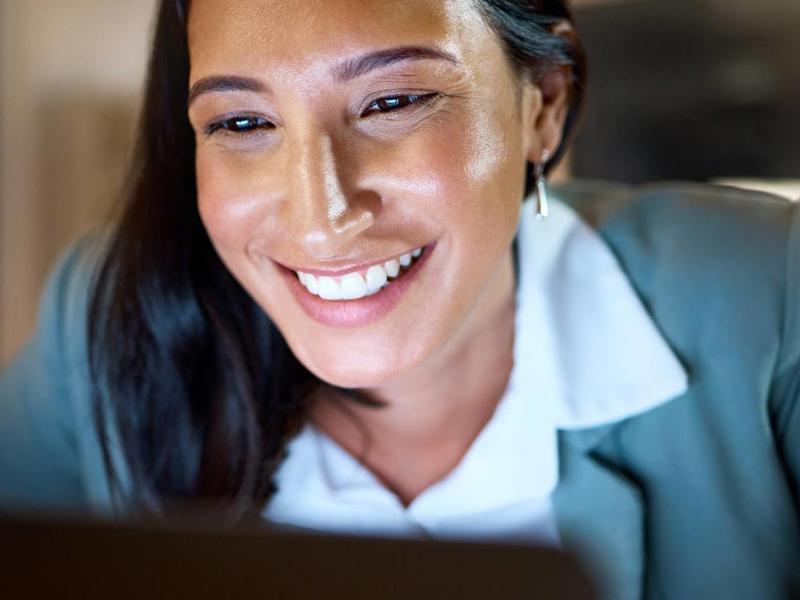 An image of a smiling woman. Elevated Networks provides services that can be utilized by organizations in multiple areas.