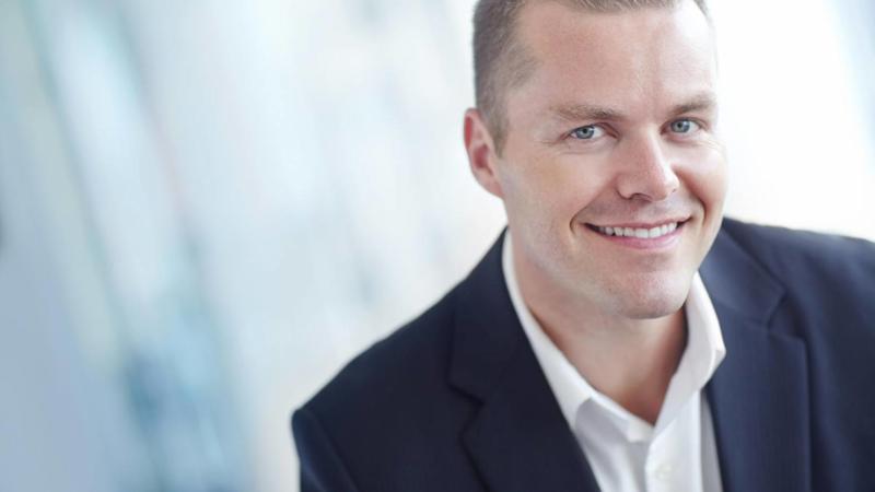 An image of a smiling man. Elevated Networks offers client-focused management solutions.
